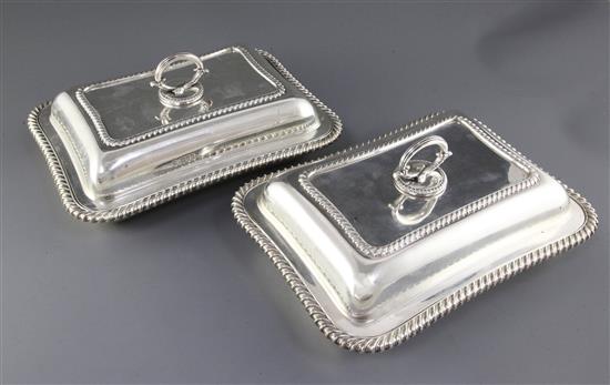 A pair of Edwardian silver entree dishes by William Hutton & Sons Ltd, 129 oz.